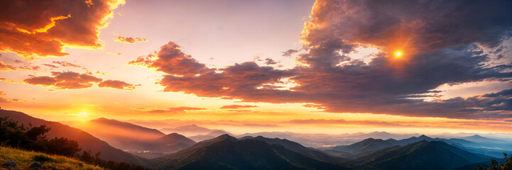 Fototapeta premium Golden light casting a serene glow over mountain peaks at sunset, with panoramic views and calm orange skies creating a peaceful atmosphere perfect for capturing the relaxing beauty of summer nature