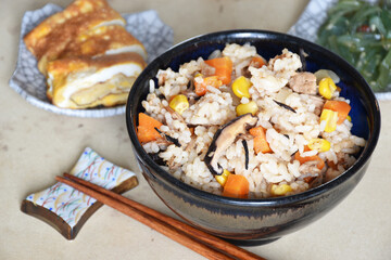 Takikomi Gohan is a Japanese rice dish with short-grain rice with vegetables, mushrooms, seafood, or meat. Often served with rolled egg omlette tamagoyaki