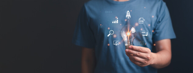 Man holding lightbulb showing startup business idea growth  modern virtual interface rocket. launch rockets start flying up. concept of digital technology network strategy startup.