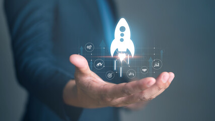Startup idea business development project to achievement or Man holding rocket manage digital marketing plan to success. Concept technology research data in the future.
