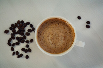 cup of coffee with beans