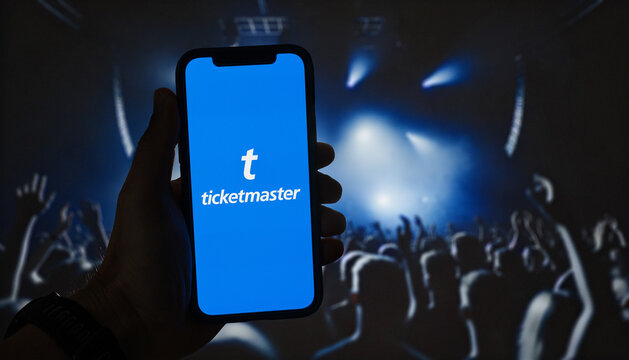 Person holding smartphone with Ticketmaster app on the screen