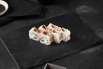 Bacon and Cucumber Roll on Slate with Dark Aesthetic Shot in High Contrast