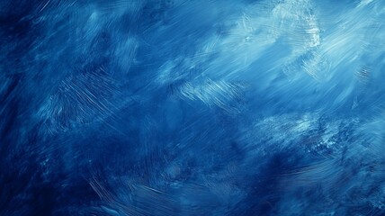 Monochromatic blue abstract background with various textures, creating a visually engaging and dynamic composition. Simplicity and minimalism through tonal variation and texture.