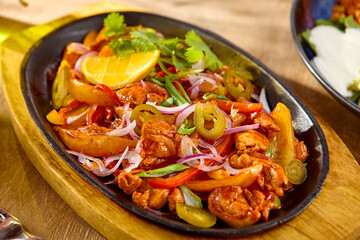 Delicious Pork Fajitas with Mixed Vegetables on a Wooden Platter