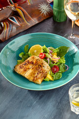 Gourmet White Fish Steak with Fresh Vegetable Salad on Turquoise Plate - Bright and Colorful Food Photography