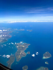 Beautiful view of the ocean and the islands from the plane window 