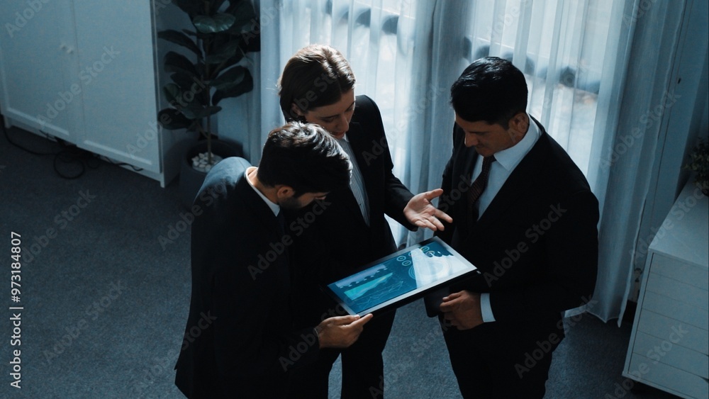 Poster top down aerial view of smart manager standing with diverse team and analyze financial data from tab