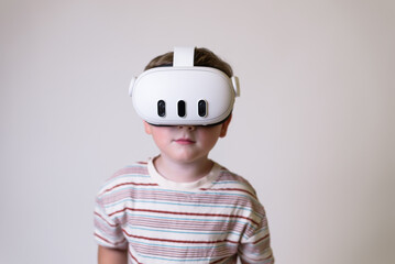 boy with virtual reality glasses on white background. free space. new technologies