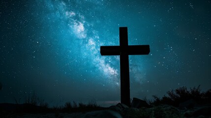 Fototapeta premium Cross silhouette against a starry night sky Close-up photo with clean background