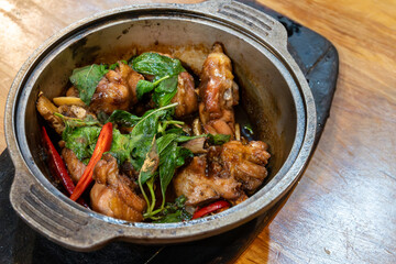 Three-cup chicken, San Bei Ji, in a metal pot, Taiwanese traditional food