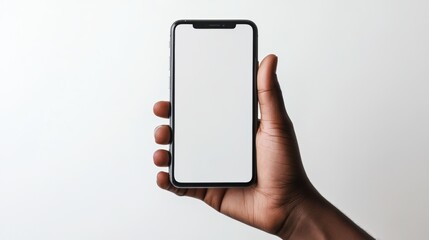 Hand grasping a smartphone screen facing forward and blank with a professional clean white backdrop