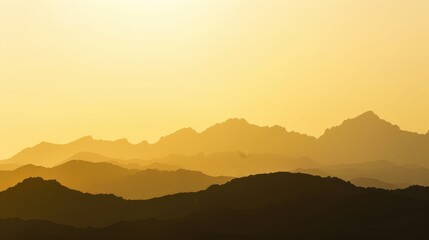 Obraz premium Golden light bathing mountain silhouettes at sunrise, clear horizon Close-up photo with clean background