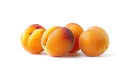 A selection of ripe apricots arranged neatly on a surface