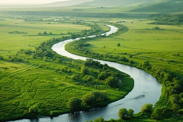 A serene river flows gently through a picturesque countryside with lush green vegetation