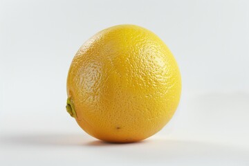 A single orange sitting on a white surface
