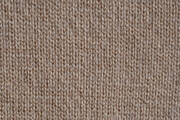 texture of knitted light brown sweater, close-up texture of beige knitted fabric, macro texture of tan knitted woolen clothes