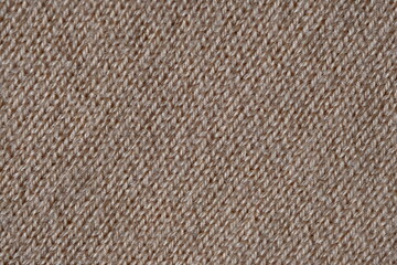texture of knitted light brown sweater, close-up texture of beige knitted fabric, macro texture of tan knitted woolen clothes