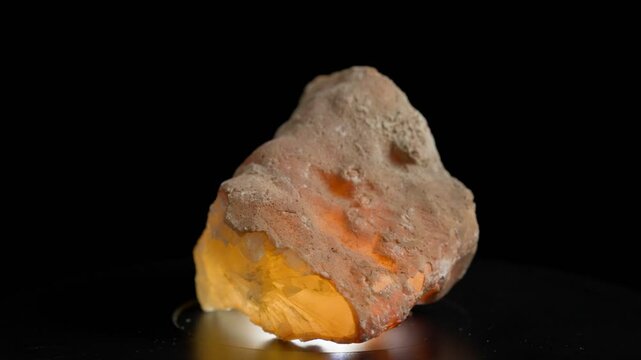 Underlit Calcite Crystal Turning. High quality 4k footage