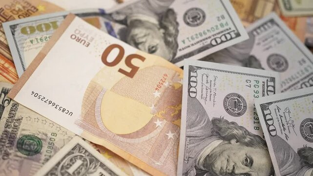 Euro and dollar banknotes on table highlight importance of currencies in international trade agreements facilitating cross-border commerce and economic stability
