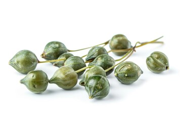 A collection of green fruits sit on a white surface