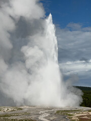 The eruption of Old Faithful in Yellowstone National Park spews steam hundreds of feet into the air
