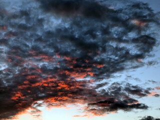 Abstract Thunder Sloud Red and Black Heavy Rain  Clouds in the sky as a Skyscape