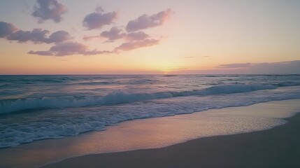 A serene beach landscape at sunset, featuring soft waves lapping against the shore with a pastel sky