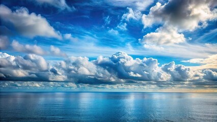 Obraz premium Cloudy sky with patches of blue over ocean