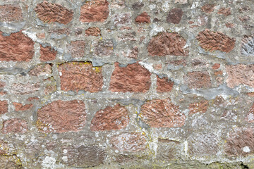 Red brown sandstone block and mortar building wall background texture ideal graphic design element