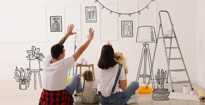 Young family with dog imaging new design of their home