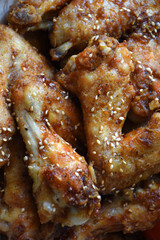 Tebasaki is a popular Japanese dish, particularly famous in Nagoya. It consists of fried, crispy chicken wings topped with sesame seeds. Delicious homemade meal.