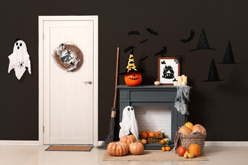 Interior of living room decorated for Halloween with door and mantelpiece