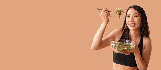 Beautiful young Asian woman with bowl of fresh vegetable salad on beige background. Weight loss concept