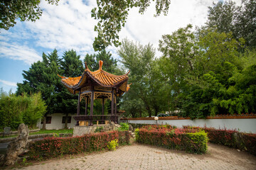 Fototapeta premium Chinese kiosk in a garden on a sunny day in Vienna, Austria