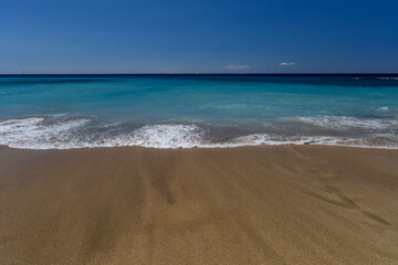 Yellow sand beach, dangerous high waves, rough Atlantic Ocean, famous Playa del Duque Teneriffe Costa Adeje