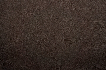 Black, brown paper blank with lines waves pattern. Texture relief copy space wallpaper background.