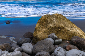 Beach with black volcanic sand, green palm trees on the slope, dangerous waves, Atlantic Ocean, Castro Beach Playa Castro Teneriffe