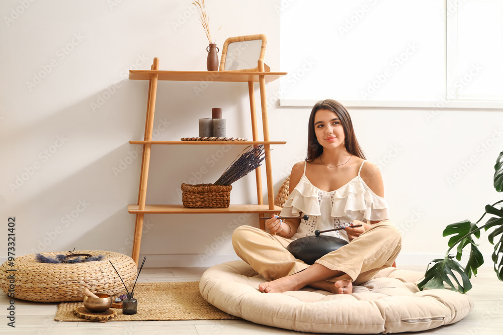 Canvas Prints Young woman with sticks playing glucophone at home