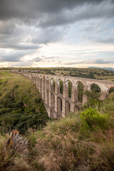Fototapeta premium Arcos del Sitio on a cloudy day in the magical town of Tepotzotlan, State of Mexico, Mexico