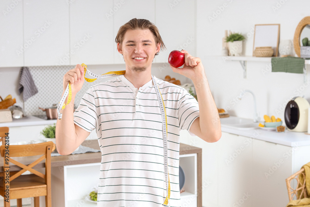 Sticker Young man with tape measures and apple in kitchen. Weight loss concept