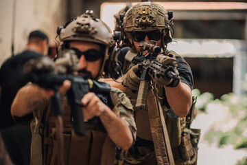 Group of soldiers shooting with weapons and rifles towards camera.