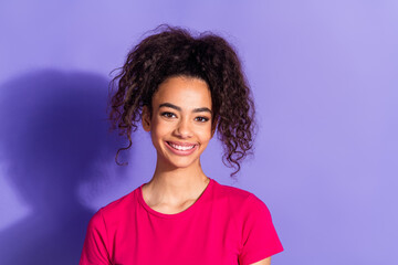 Photo of shiny attractive lady dressed pink t-shirt smiling empty space isolated purple color...
