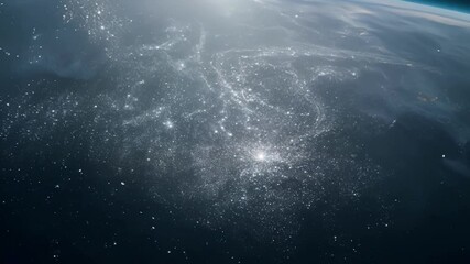 Sun rising over earth, illuminating city lights from space. Dark blue atmosphere contrasts with glowing lights, showcasing beauty of our global home in cosmos