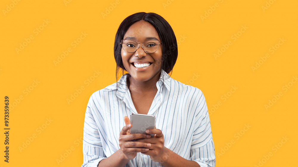 Poster black lady using mobile phone texting and browsing smiling at camera standing on pink studio backgro