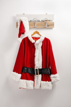 Santa claus coat and hat hanging