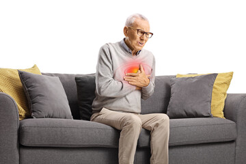Elderly man with cardiac arrest sitting on a sofa