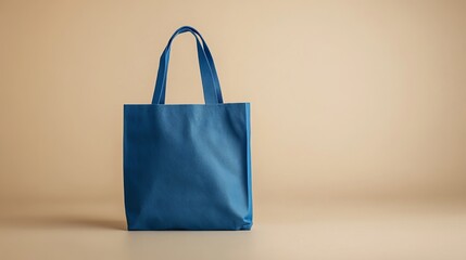 A blank blue tote bag on a neutral background, with space for branding or design mockup.