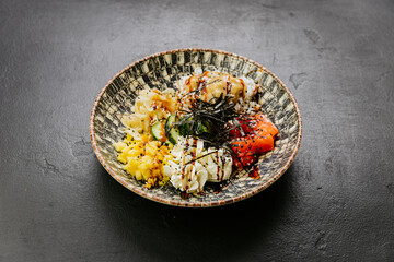 Delicious poke bowl with fresh salmon, mango, rice, seaweed - perfect for healthy and colorful meals