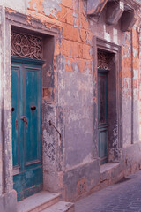 Old ruined facade buildings in the beautiful old town of touristic Gozo, Malta Island